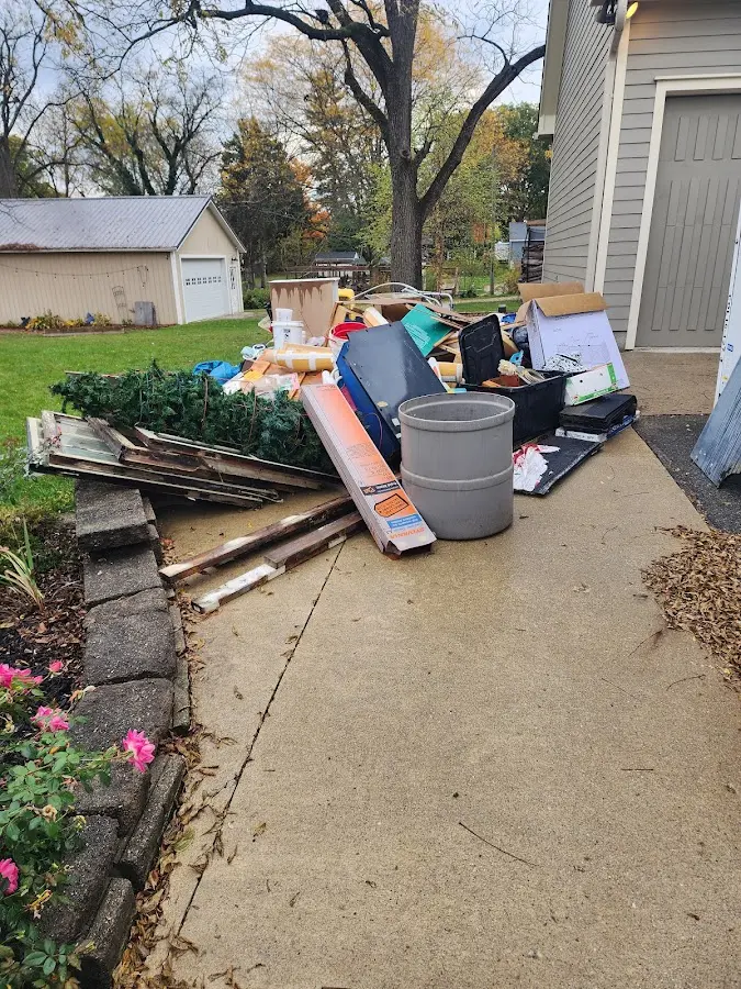 Dumpster being loaded with debris for 3 Yard Dumpster Rental in DeRidder